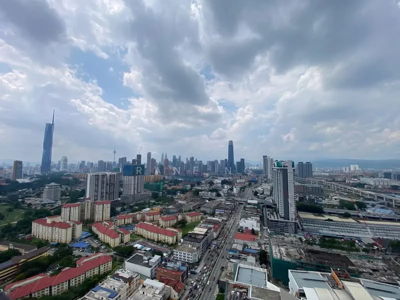Exterior type: high-rise condominium; features: city skyline view, surrounded by urban development, visible roadways, high-rise buildings, green spaces, cloudy sky; style: modern.