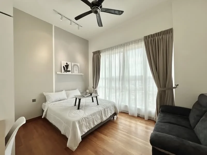 Bedroom features: queen-size bed with white bedding, wooden flooring, floor-to-ceiling windows, sheer curtains, dark grey fabric sofa, ceiling fan with light, wall-mounted shelf with decor, neutral painted walls; style: modern; view: city.
