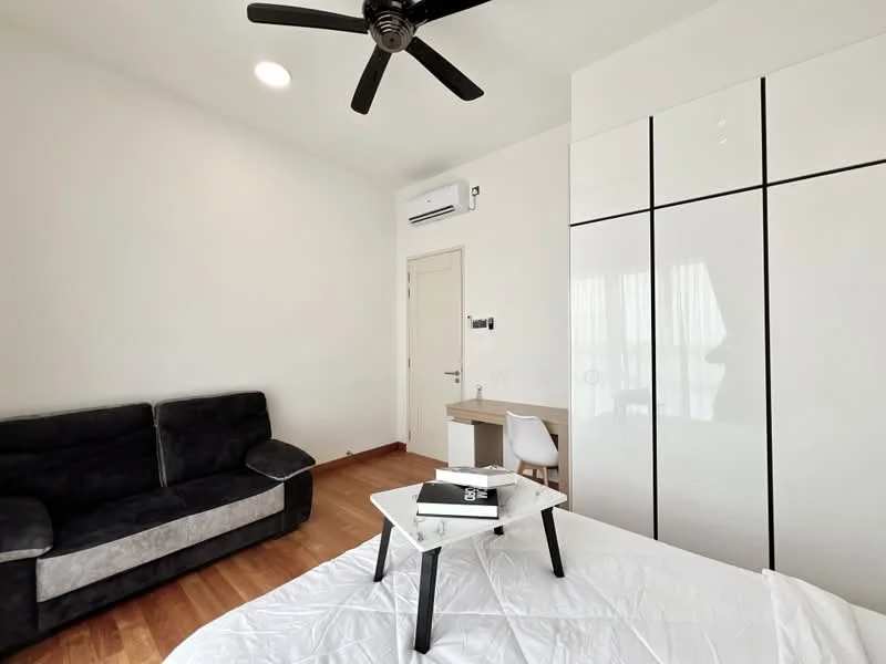 Bedroom features: queen-size bed, white bedding, black fabric sofa, white study desk, white chair, built-in wardrobe with sliding doors, wooden flooring, wall-mounted split AC, ceiling fan with light, window with sheer curtains; style: modern.