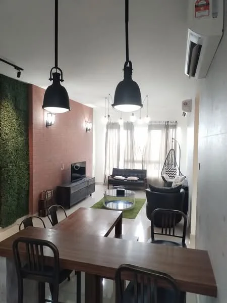 Living features: sofa with cushions, hanging chair, coffee table, TV console, wall-mounted TV, green accent wall with plants, brick feature wall, large windows with sheer curtains, recessed downlights, pendant lights, area rug, air conditioning unit; style: modern; view: city. Dining features: wooden dining table, black dining chairs, open layout, pendant lighting above table; style: modern.