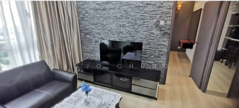 Living features: dark leather sofa, glass coffee table with lace tablecloth, wall-mounted flat-screen TV, black TV console with drawers, textured stone accent wall, floor-to-ceiling windows with sheer curtains, wooden flooring, decorative blue flowers in vase; style: modern; view: city. Room features: doorway leading to another room, light-colored wall, wooden flooring.