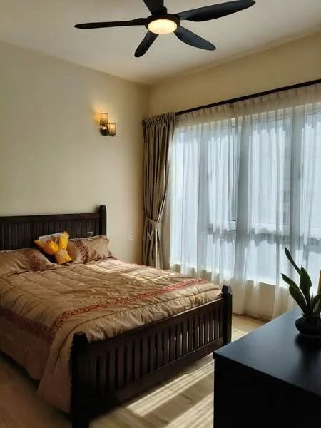 Bedroom features: king-size bed with decorative bedding, upholstered headboard, 2 bedside lamps, wooden bed frame, floor-to-ceiling windows with sheer curtains, curtains in beige, ceiling fan with light, wooden flooring, decorative wall sconce, potted plant on bedside table; style: modern.