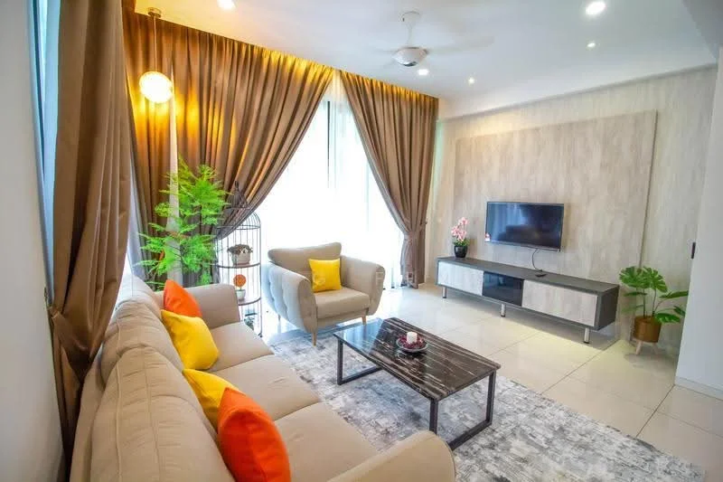 Living features: 3-seater fabric sofa in beige, 2 accent pillows in orange, 1 accent pillow in yellow, coffee table with marble top, TV console in grey, wall-mounted TV, area rug with geometric pattern, floor-to-ceiling windows, sheer curtains, dropped ceiling with recessed lighting, ceiling fan, decorative plant in pot; style: modern; view: garden.