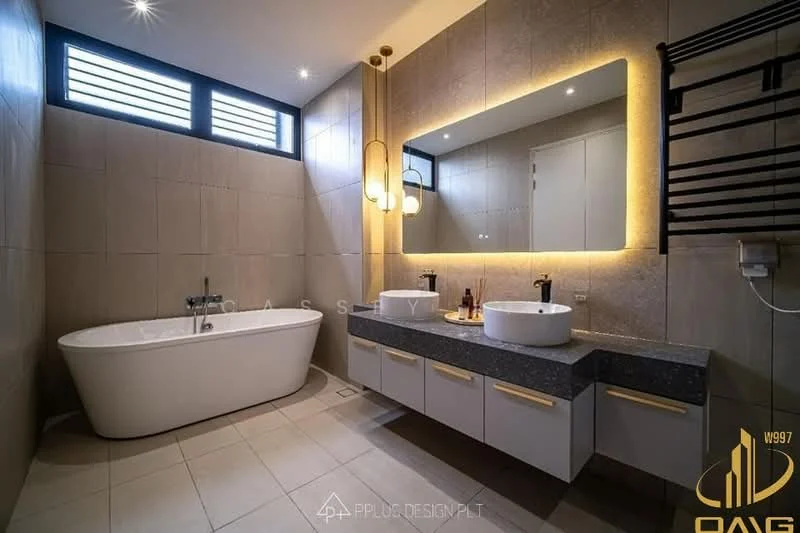 Bathroom features: freestanding bathtub, double-sink vanity with grey countertop, wall-mounted mirror with LED backlighting, chrome basin mixers, tiled walls in neutral tones, large format floor tiles, sliding window with horizontal slats, heated towel rail, built-in cabinetry under sink, recessed lighting, wall-mounted storage shelf; style: modern.