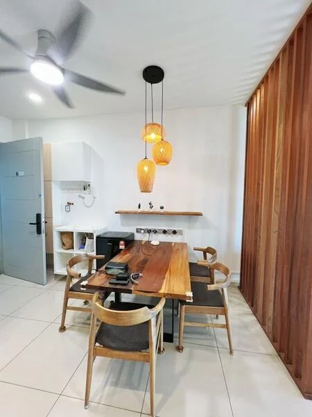 Dining features: wooden dining table, 4 wooden dining chairs, pendant lighting with three orange glass shades, white walls, ceiling fan, open shelving above table, black side cabinet, tile flooring; style: modern. Room features: grey door, kitchenette with white cabinets, wall-mounted electrical outlets.