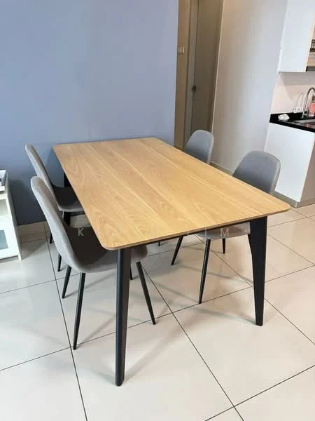Dining features: rectangular dining table with light wood top, black metal legs on table, 4 grey upholstered dining chairs, white tiled flooring, light blue painted wall, open kitchen visible in background, kitchen cabinetry, countertop with sink; style: modern.