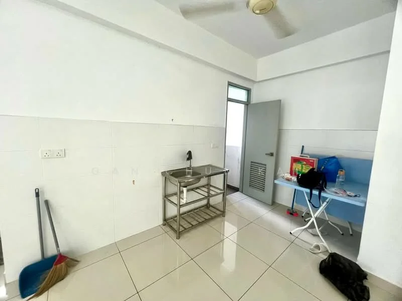 Room features: white painted walls, glossy tile flooring, ceiling fan, stainless-steel sink, metal shelving unit, blue table, white folding chair, door with ventilation grill, broom, black bag on floor.