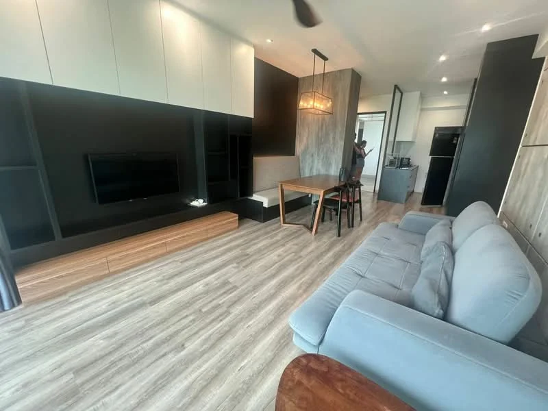Living features: grey fabric sofa, wooden coffee table, TV console with storage, wall-mounted TV, dining table with four chairs, pendant light fixture, laminate flooring, recessed lighting, open shelving, black accent wall, large windows with sheer curtains; style: modern.