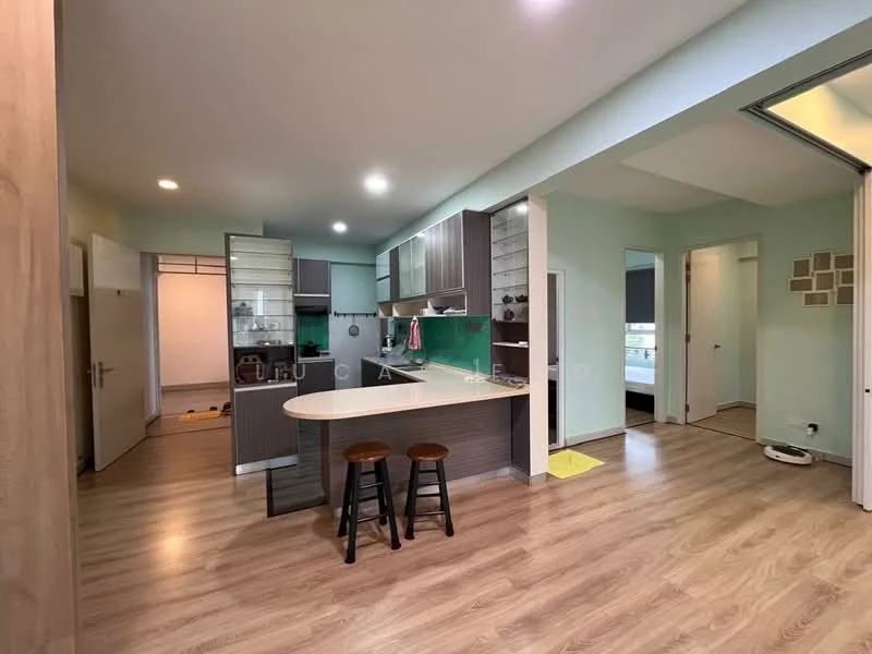 Kitchen features: L-shaped kitchen layout, grey cabinetry, white countertop, green backsplash, stainless-steel sink, chrome pull-down faucet, built-in oven, freestanding range oven, refrigerator, 2 bar stools, wooden flooring, recessed downlights; style: modern. Living features: open-plan layout, wooden flooring, natural light from windows, light green walls, sliding glass door, area rug; style: modern. Room features: doorway leading to another room, neutral wall color, light fixtures.