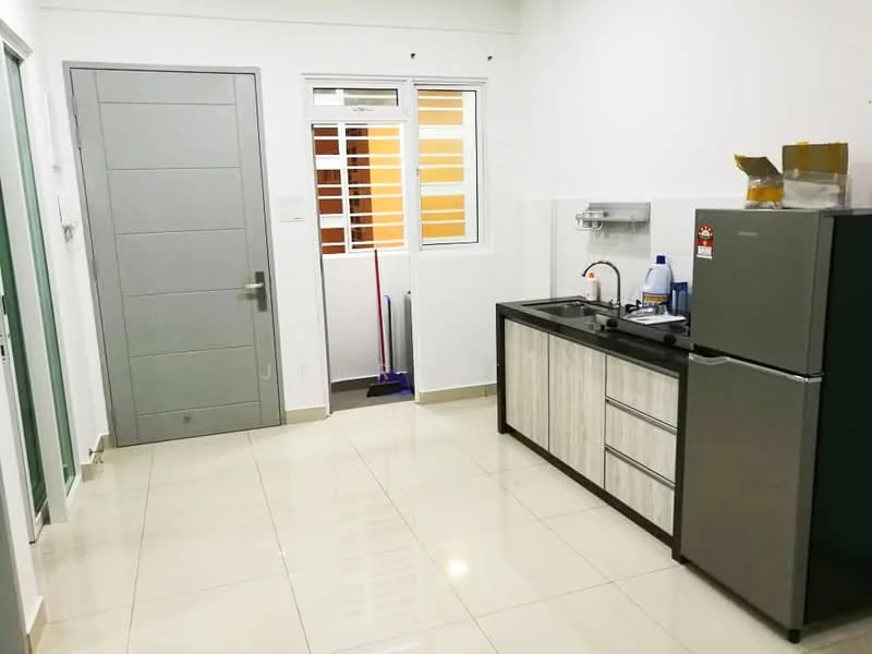 Kitchen features: white painted walls, glossy tile flooring, single-bowl stainless-steel sink, chrome pull-down faucet, black countertop, wood cabinetry with grey finish, stainless-steel fridge, window with horizontal slats, cleaning supplies visible, door leading to another room; style: modern.