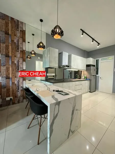 Kitchen features: marble countertop, grey cabinetry, stainless-steel appliances, built-in oven, freestanding fridge, pendant lighting, wall-mounted cabinets, tile flooring, wood accent wall, sink, kitchen island with seating; style: modern.