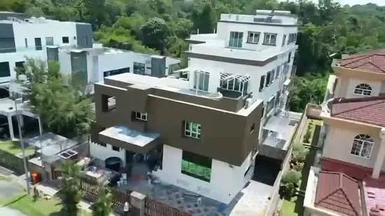 Exterior type: detached bungalow; features: two-storey building, flat roof, white painted facade, brown accent wall, large windows, balconies on upper level, manicured lawn, paved driveway, surrounded by greenery, adjacent to other residential buildings; style: modern.