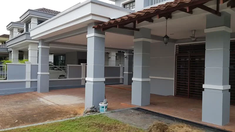 Exterior type: detached bungalow; features: grey painted facade, white columns, terracotta roof tiles, paved walkway, manicured lawn, outdoor ceiling fan, lantern-style light fixture, open porch area, fenced perimeter, sliding wooden door, covered entrance; style: modern.