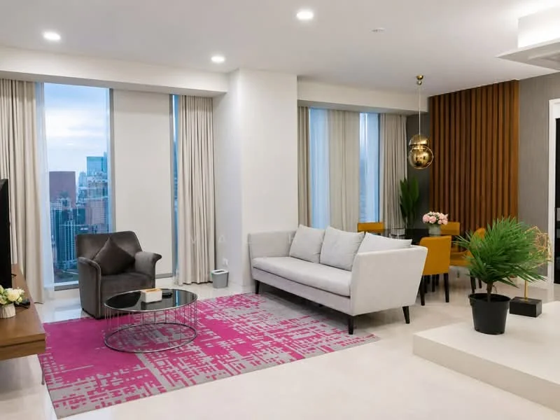 Living features: grey fabric sofa, 3-seater sofa, black coffee table, area rug with geometric pattern in pink, floor-to-ceiling windows, sheer curtains, wood accent wall, pendant light, decorative plant, dining table with chairs, wall-mounted TV, light-colored walls, recessed downlights; style: modern; view: city.