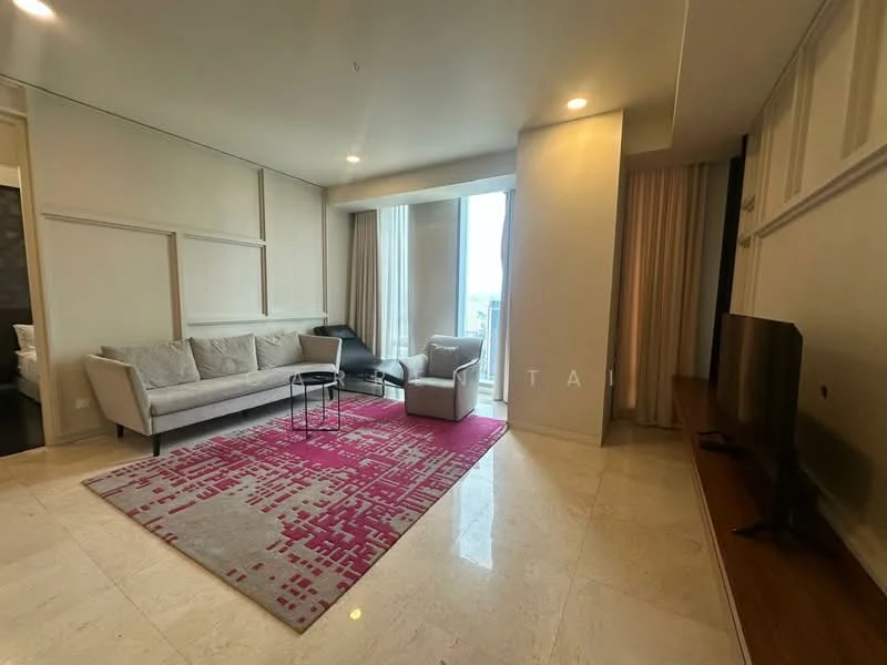 Living features: cream painted walls, marble tile flooring, floor-to-ceiling windows, sheer curtains, 3-seater fabric sofa in light grey, black accent chair, glass coffee table, area rug with geometric pattern in pink and white, wall-mounted TV, wooden TV console, decorative wall paneling; style: modern; view: city.