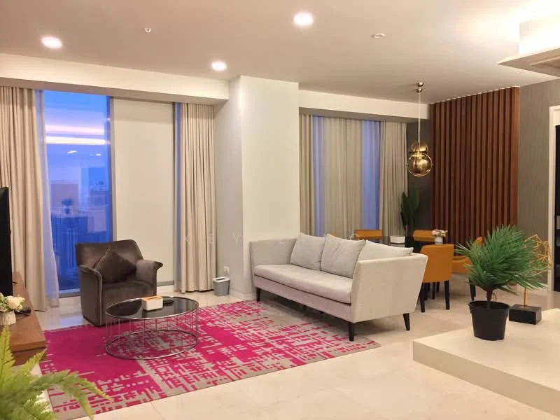 Living features: grey fabric sofa, 3-seater sofa, brown leather armchair, round coffee table with metal base, area rug with geometric pattern in pink, flat-screen TV on wooden console, floor-to-ceiling windows with sheer curtains, recessed ceiling lights, decorative indoor plant, wood panel accent wall, dining area with four yellow upholstered chairs, pendant light fixture; style: modern; view: city.