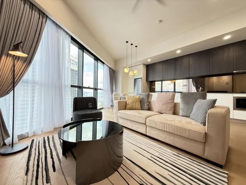 Living features: floor-to-ceiling windows, sheer curtains, 3-seater fabric sofa in beige, decorative cushions in various colors, black coffee table, area rug with geometric pattern, pendant lighting with multiple bulbs, wooden flooring, wall-mounted TV, open-plan layout to kitchen, decorative wall art; style: modern; view: city.