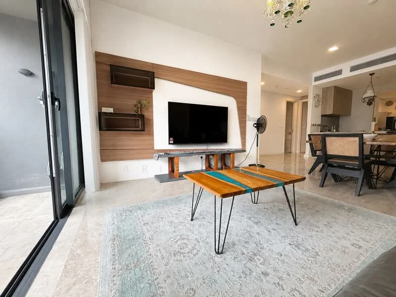 Living features: wooden coffee table with metal legs, flat-screen TV mounted on wall, wood feature wall, light-colored tile flooring, area rug with geometric pattern, ceiling light fixture with decorative elements, floor-to-ceiling windows, sliding glass door, wall-mounted fan; style: modern.