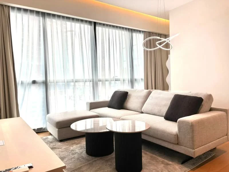 Living features: 3-seater fabric sofa in light grey, 2 black accent cushions, round coffee table with glass top, 2 cylindrical black side tables, floor-to-ceiling windows, sheer curtains, wooden flooring, recessed LED downlights, decorative pendant light; style: modern; view: city.