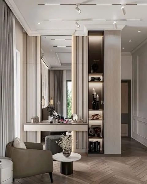 Living features: light wood herringbone flooring, cream painted walls, recessed ceiling lights, track lighting, large windows with sheer curtains, built-in shelving unit with decorative items, console table with decorative accessories, upholstered armchair in grey, decorative vase with flowers, wall-mounted mirror, crown moulding; style: modern; view: garden.