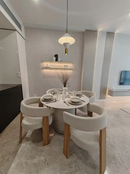 Dining features: round dining table, upholstered dining chairs with wooden legs, decorative wall shelf, pendant light fixture, neutral wall color, marble flooring, wall-mounted TV, textured wall panels; style: modern.