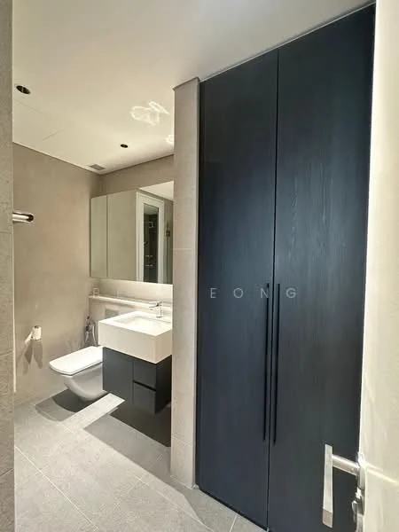 Bathroom features: wall-mounted toilet, single-sink vanity with dark cabinetry, mirror above vanity, chrome basin mixer faucet, grey tile flooring, light grey wall tiles, built-in storage cabinet, recessed lighting; style: modern.