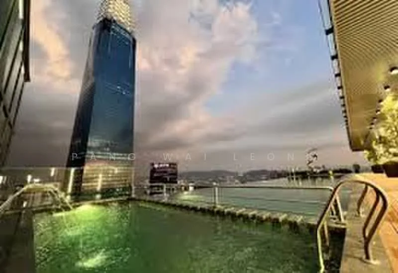 Exterior type: high-rise condominium; features: infinity pool, city skyline view, glass curtain wall facade, surrounded by water, outdoor deck area, night lighting, modern architecture; style: modern.