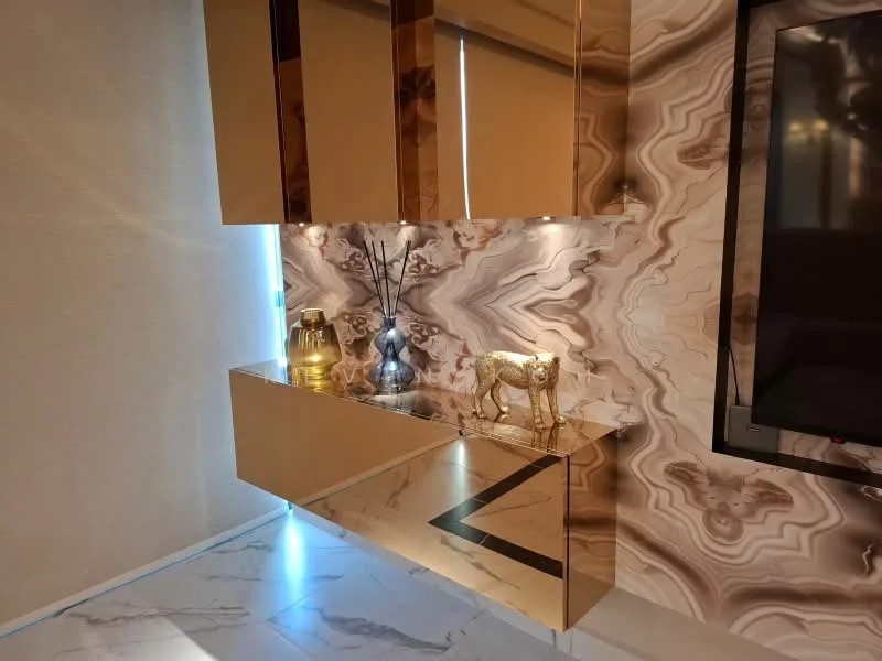 Living features: golden marble console table, decorative vase, decorative figurine of a cow, wall-mounted TV, textured wall with marble pattern, roller blinds, ambient lighting, white marble flooring; style: modern.