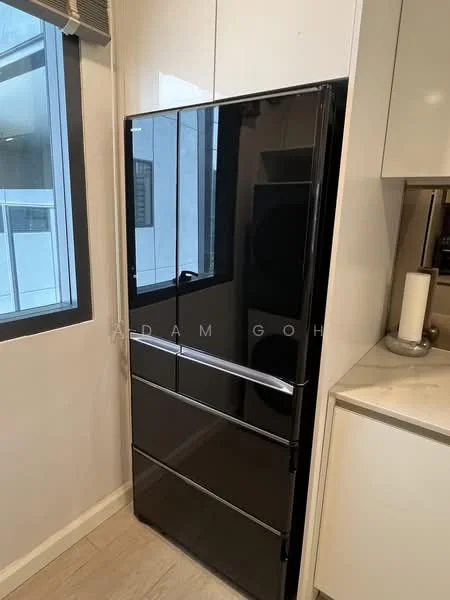 Kitchen features: black fridge, white cabinetry, marble countertop, window with view, light wood flooring; style: modern.