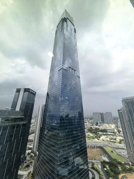 Exterior type: high-rise condominium; features: glass curtain wall, tall skyscraper, modern architectural design, surrounded by urban landscape, city skyline view, multiple floors, prominent tower, reflective glass facade; style: modern.