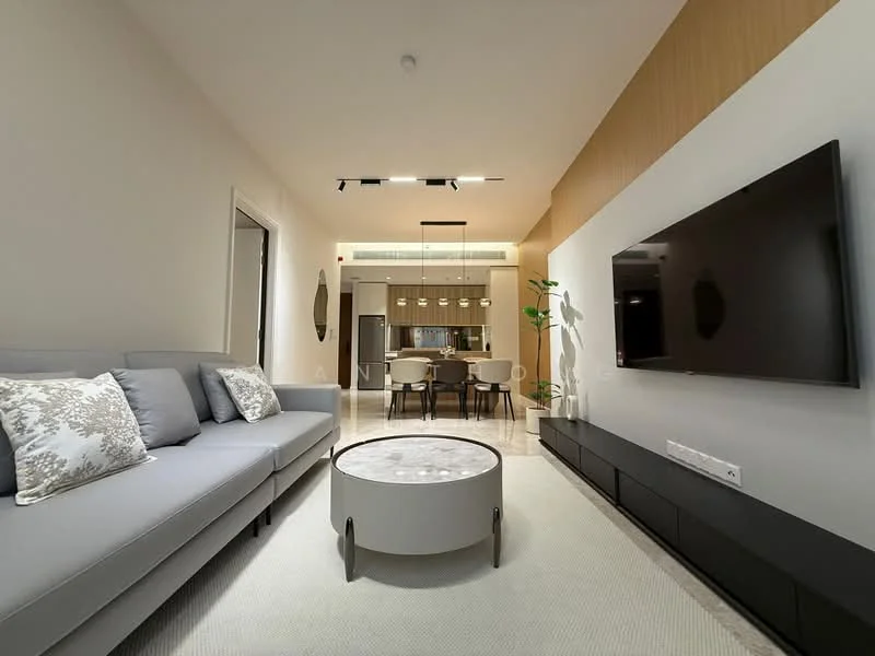 Living features: 3-seater fabric sofa in light grey, round coffee table with white top, TV console in black, wall-mounted flat-screen TV, recessed LED downlights, decorative wall mirror, plant in ceramic pot, neutral wall colour, carpet flooring, open layout to dining area; style: modern.
