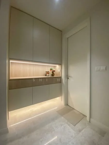Room features: built-in cabinetry with light wood finish, white painted walls, marble tile flooring, recessed lighting, decorative shelf with small decor items, modern door with handle, soft lighting under cabinetry; style: modern.