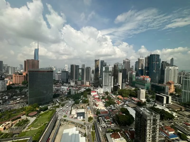 Exterior type: high-rise condominium; features: city skyline view, surrounded by urban landscape, green park area visible, multiple high-rise buildings, mixed-use development, busy road with traffic, cloudy sky, modern architectural designs; style: modern.