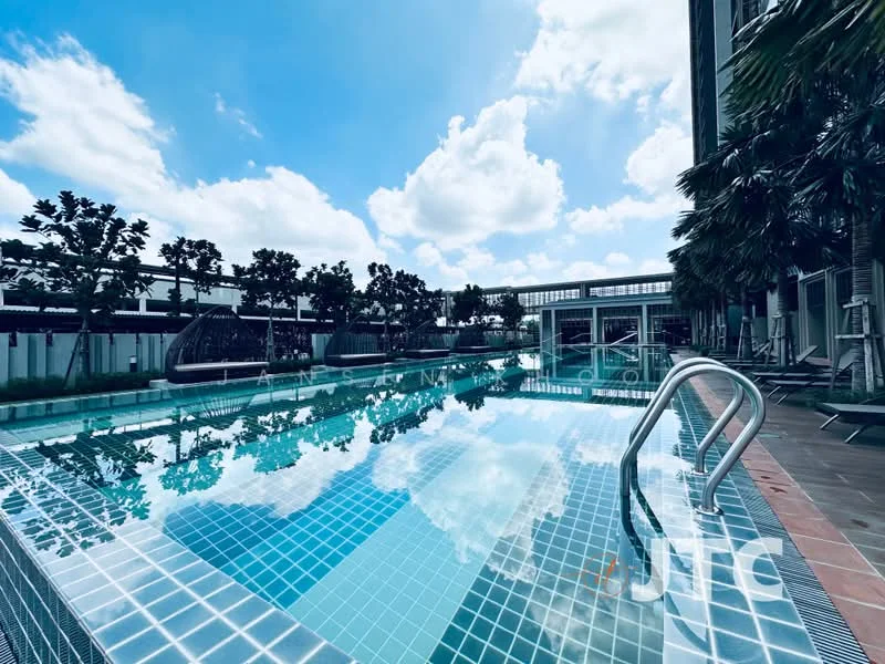 Exterior type: swimming pool deck; features: infinity pool, tiled pool deck, poolside loungers, landscaped greenery, surrounding palm trees, clear blue sky, sunny weather, glass railing, pool steps, shaded area with seating; style: modern.
