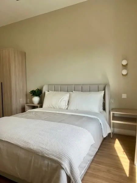 Bedroom features: king-size bed with upholstered headboard, white bedding, light grey throw blanket, wooden bedside table, decorative plant in ceramic pot, built-in wardrobe, wall-mounted light fixtures, laminate flooring, neutral painted walls; style: modern.