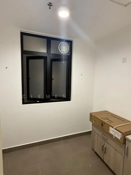 Room features: white painted walls, grey floor tiles, large window with black frame, ceiling light fixture, built-in cabinet with wood finish, unpacked cardboard box.