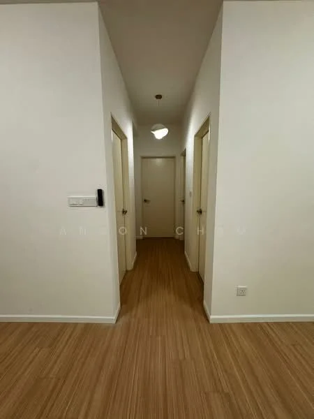 Hallway features: white painted walls, wooden flooring, ceiling light fixture, multiple doorways, neutral color scheme, baseboards, door handles, light switch; style: modern.