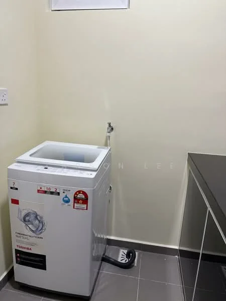 Laundry features: top-load washing machine, grey tiled flooring, white painted walls, black countertop, sink with faucet, power outlet, drainage pipe, space for storage.