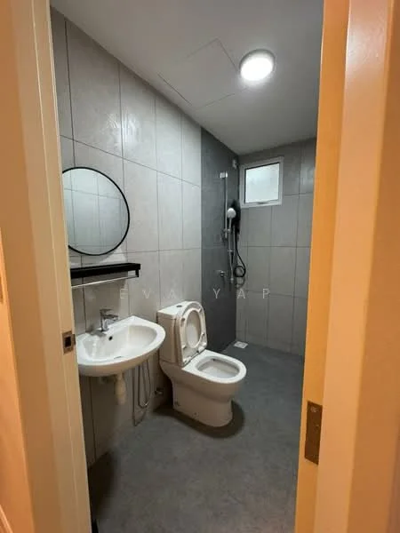 Bathroom features: grey tiled walls, grey tiled flooring, round mirror, single-sink vanity with wall-mounted faucet, one-piece toilet, handheld shower, shower head, recessed ceiling light, window for natural light; style: modern.