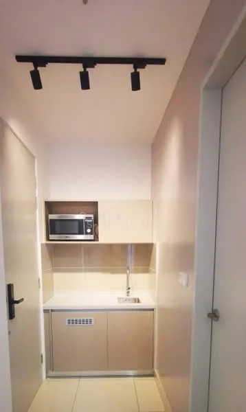 Kitchen features: microwave, single-bowl stainless-steel sink, chrome pull-down faucet, light-colored cabinetry, countertop with light finish, tile backsplash, built-in kitchen appliances, recessed lighting, ceramic tile flooring; style: modern.