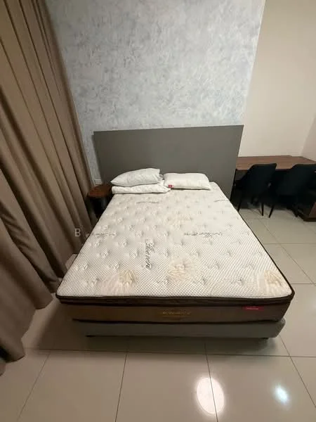 Bedroom features: queen-size bed, mattress with floral pattern, two pillows, grey upholstered headboard, cream curtains, light-coloured wall with texture, tile flooring, wooden bedside table, desk with black chairs; style: modern.