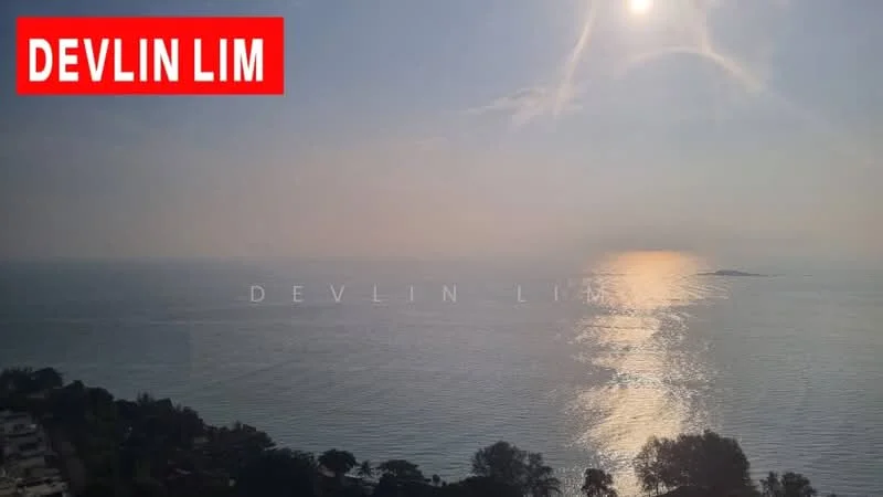 Exterior features: sea view, sunset reflection on water, coastal landscape, distant island, tree line along the shore.