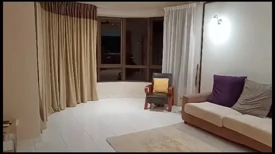 Living features: floor-to-ceiling windows, curtains in beige and white, light-colored walls, white tiled flooring, sofa in light brown, purple accent pillows, wooden armchair, yellow cushion on armchair, wall-mounted light fixture, area rug with neutral tones; style: modern.