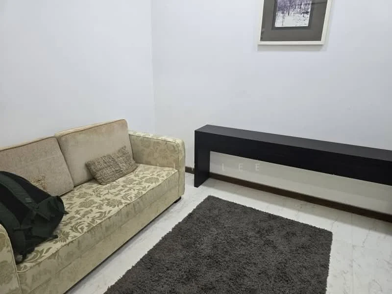 Living features: beige fabric sofa with floral pattern, black console table, grey area rug, white painted walls, marble flooring, framed artwork on wall; style: modern.