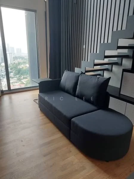 Living features: black fabric L-shape sectional sofa, wooden flooring, floor-to-ceiling windows, city skyline view, black accent wall with vertical slats, staircase with open risers, side table, natural light; style: modern; view: city.