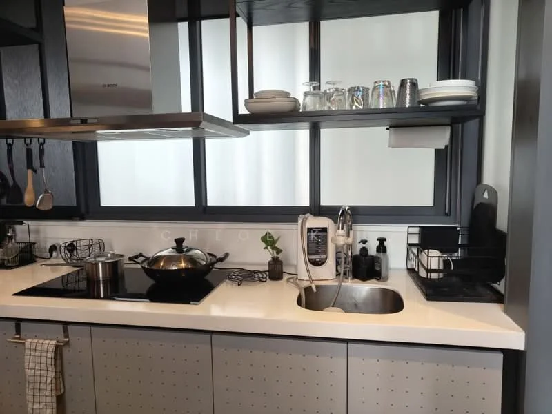 Kitchen features: white quartz countertop, stainless-steel single-bowl sink, chrome pull-down faucet, black induction cooktop, stainless-steel pot, black frying pan, black kitchen cabinetry, open shelving, glass jars, white plates, black dish rack, kitchen towel, decorative plant; style: modern.