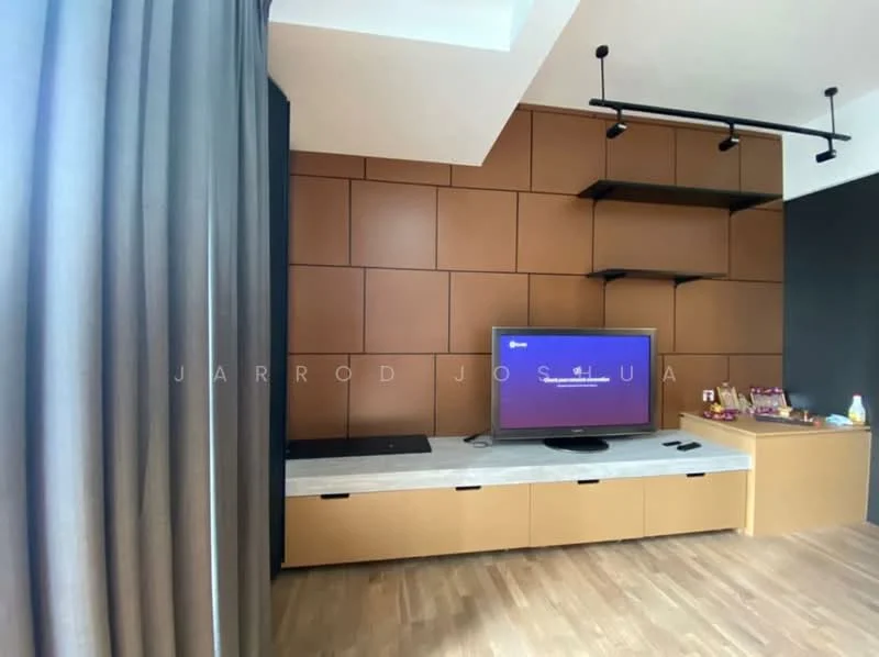 Living features: brown accent wall with wood paneling, light wood flooring, white marble TV console, wall-mounted TV, black shelving units, grey curtains, recessed lighting, decorative items on console; style: modern.