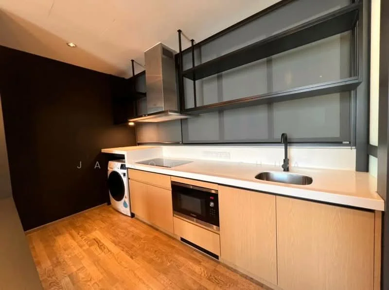 Kitchen features: stainless-steel sink, chrome pull-down faucet, white quartz countertop, built-in oven, microwave, stainless-steel range hood, white cabinetry with wood finish, open shelving, washer-dryer combo, wood flooring, black accent wall, recessed downlights; style: modern.
