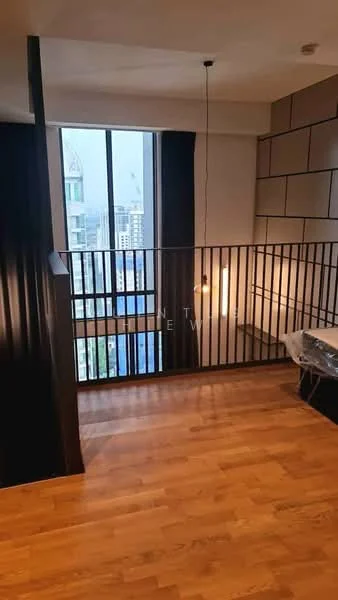 Room features: wooden flooring, black metal railing, large floor-to-ceiling windows, city skyline view, pendant light fixture, neutral wall colour, textured wall panels, open space layout; style: modern; view: city.