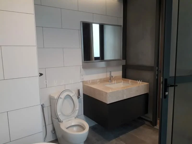 Bathroom features: white tiled walls, grey tile flooring, single-sink vanity with stone countertop, chrome basin mixer faucet, framed mirror, one-piece toilet, glass shower enclosure, built-in cabinetry; style: modern.